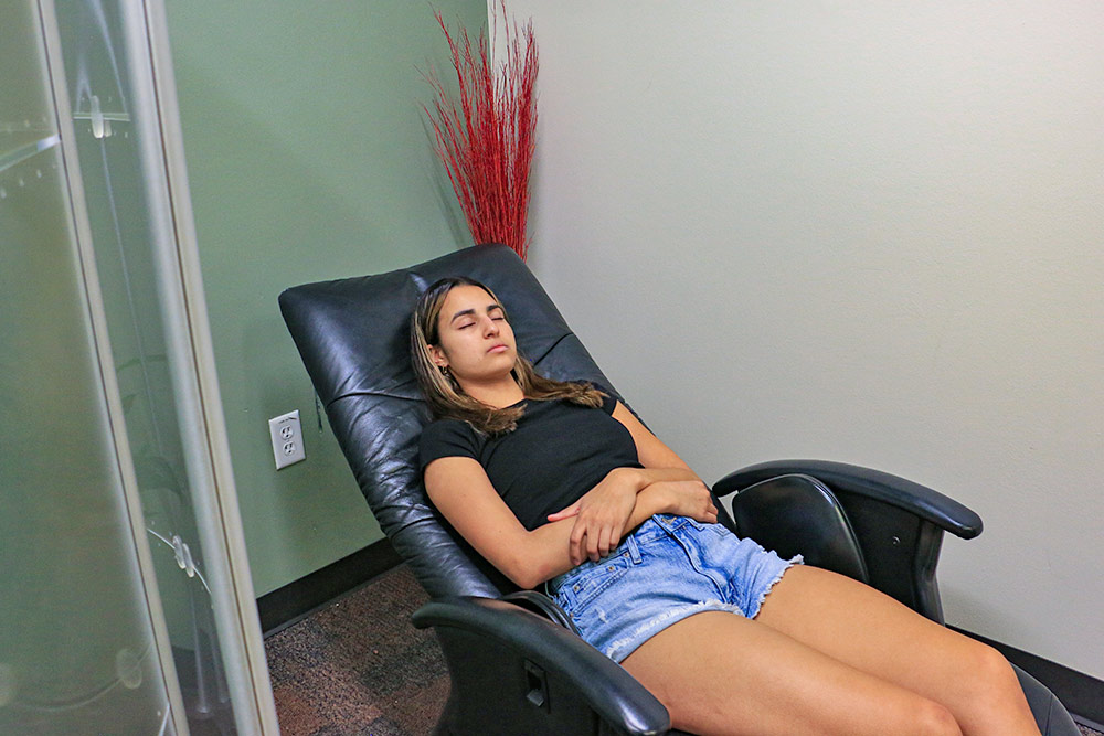student relaxing at mind body lab