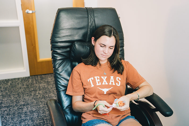 student relaxing at mind body lab